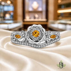 Jewelry Photography Specifications. Visual Style & Composition. Produce ultra-realistic macro photography of the uploaded Product, capturing every detail with precision. Set the product on a pure ivory silk surface to achieve a refined and timeless luxury aesthetic. Utilize background bokeh mode to simulate professional jewelry showroom scenes. Maintain absolute fidelity to the reference file regarding product design, diamond details, and camera angles. Technical Requirements & Branding. Metal color change to White Gold. Output image quality must be exactly 2100 x 2100 pixels.