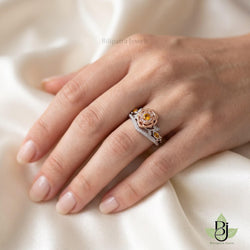 "uploaded  ring worn on a woman's finger, hand resting gracefully on a pure ivory satin fabric, lifestyle jewelry photography. ensured the product design and diamond perfectly match the reference file provided. Image Quality 2100 x 2100 pixel."