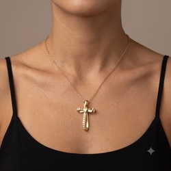 A realistic close-up studio photograph of a woman's neck, collarbones and upper chest, featuring smooth tan skin with subtle natural texture and a simple black spaghetti strap camisole, uploaded necklace resting evenly across the base of the neck and draping down to center the pendant on the chest, soft diffused frontal lighting creating gentle highlights on the metal and skin while producing faint natural shadows along the collarbones, plain seamless neutral taupe background with no additional elements, centered composition with the pendant as the clear focal point slightly lower than mid-frame, shallow depth of field keeping the necklace and skin texture sharply detailed while softly softening the outer edges of the shoulders, clean color grading with warm neutral tones, captured in high-resolution professional product photography style with even illumination and minimal post-processing. Output image quality must be exactly 2000 x 2000 pixels.